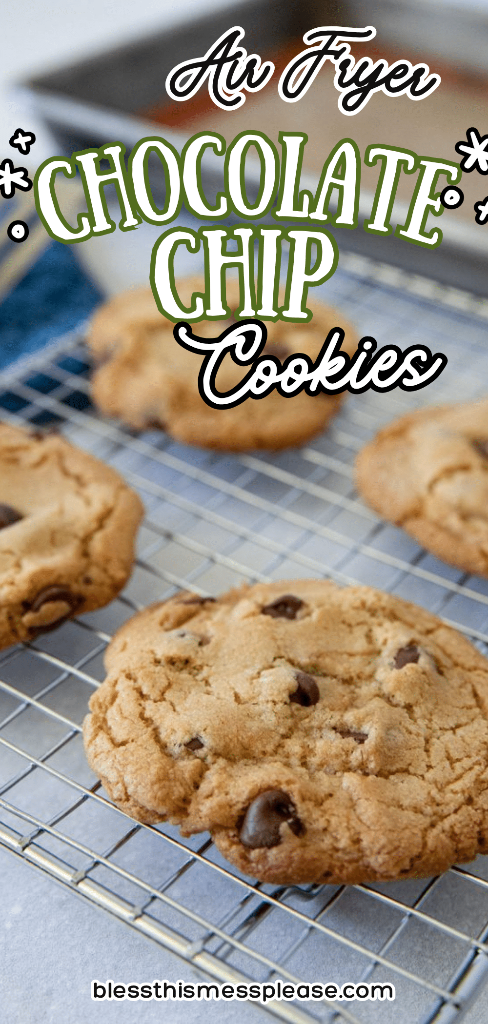 Four chocolate chip cookies cool on a wire rack with text overlay reading Air Fryer Chocolate Chip Cookies. A baking sheet is visible in the background.